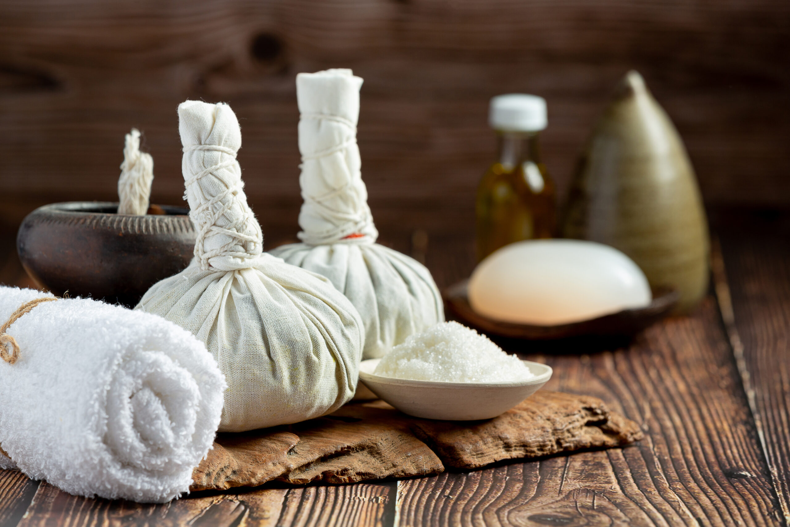 herbal spa treatment equipments put on wooden floor